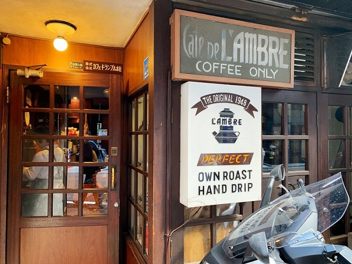 The shop front of Café de L’ambre with a large ‘Coffee Only’ sign